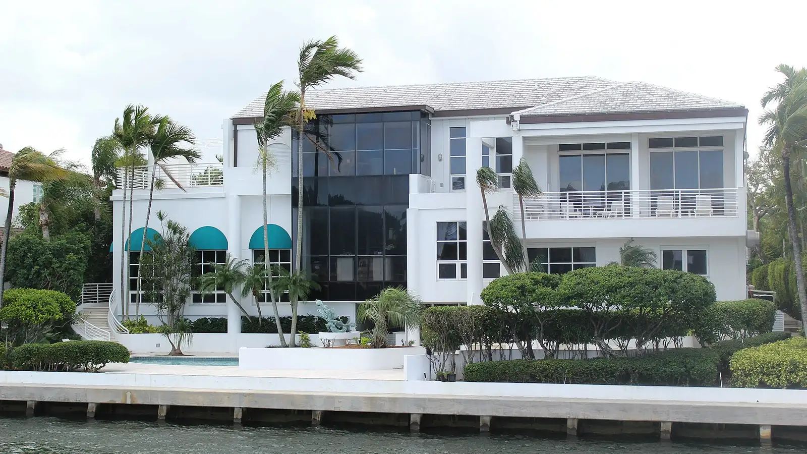 A modern waterfront home with a pool on a Miami waterway