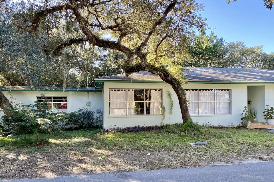 A mid-century ranch house under a live oak on Anastasia Island, St. Augustine, Florida
